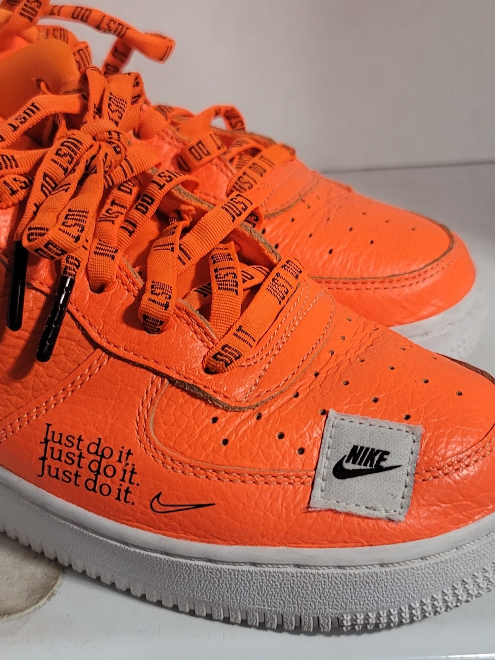 Nike Orange 'Just Do It' Low Top Sneakers